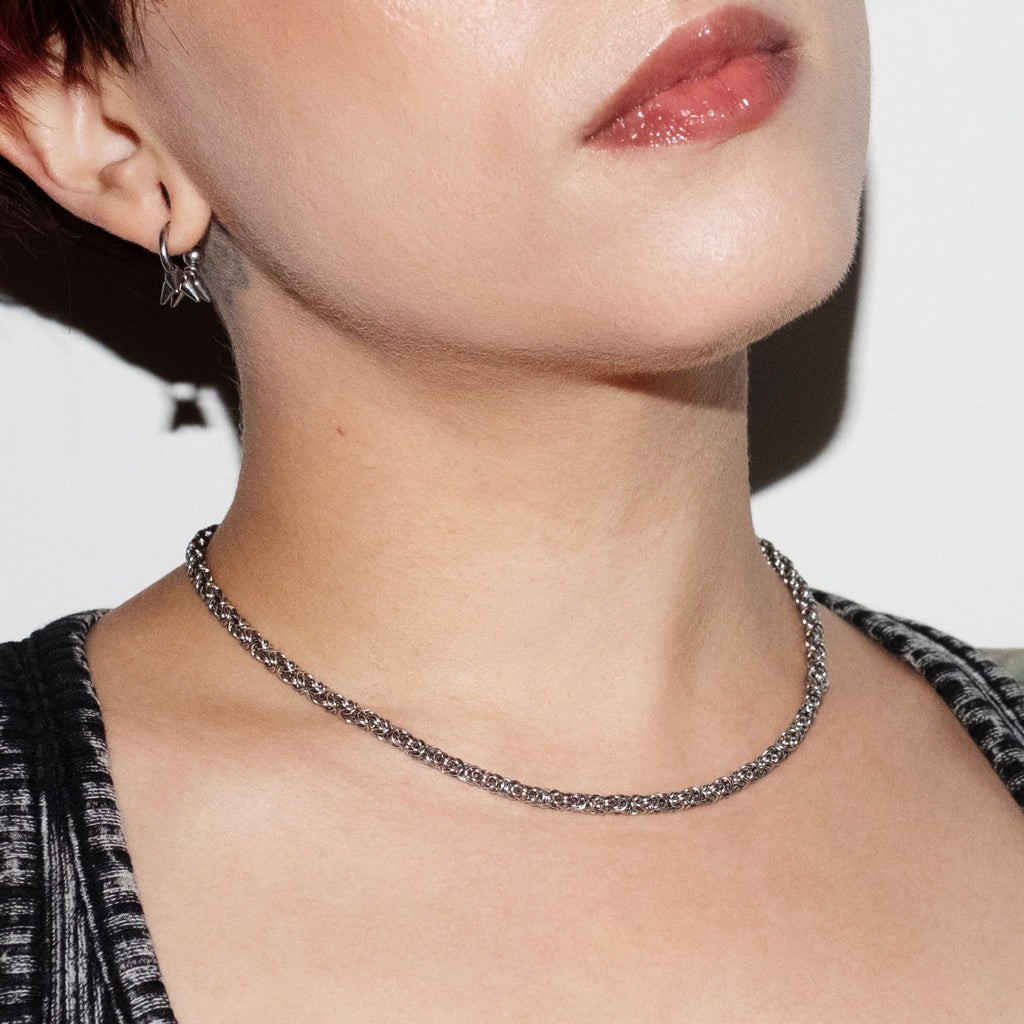 CLOSE UP SHOT ON MODEL OF GHOST BYTE NECKLACE