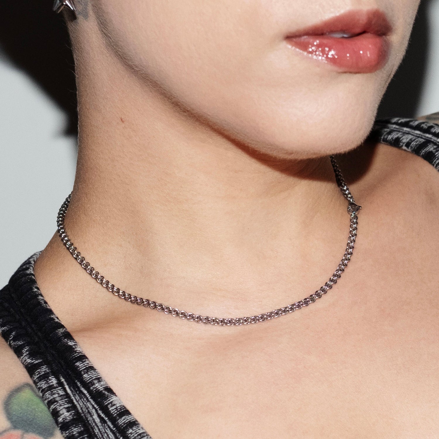 CLOSE UP SHOT OF MODEL WEARING TERMINAL BYTE NECKLACE.  CHAIN MAILLE JEWELRY.